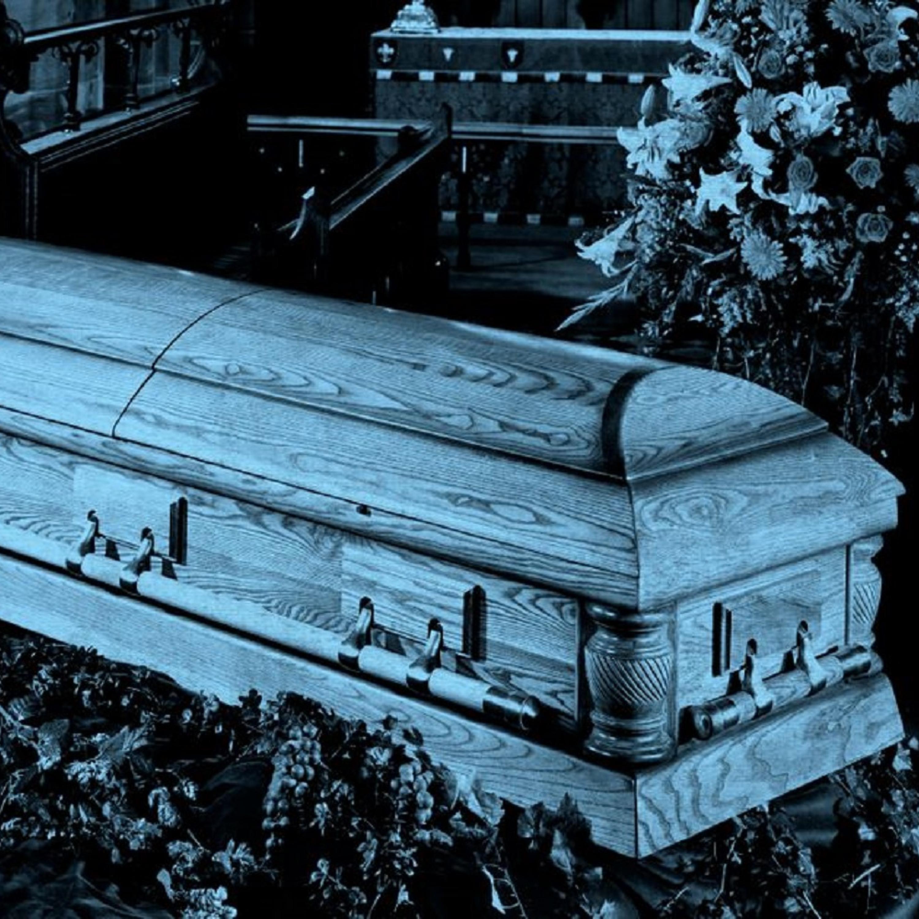 Man Runs At Coffin