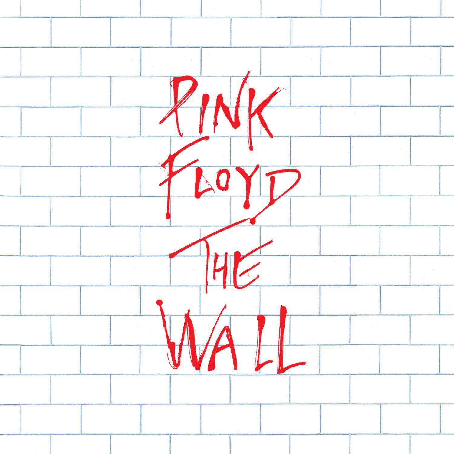 "Pink Floyd The Wall" written in red on a white brick wall