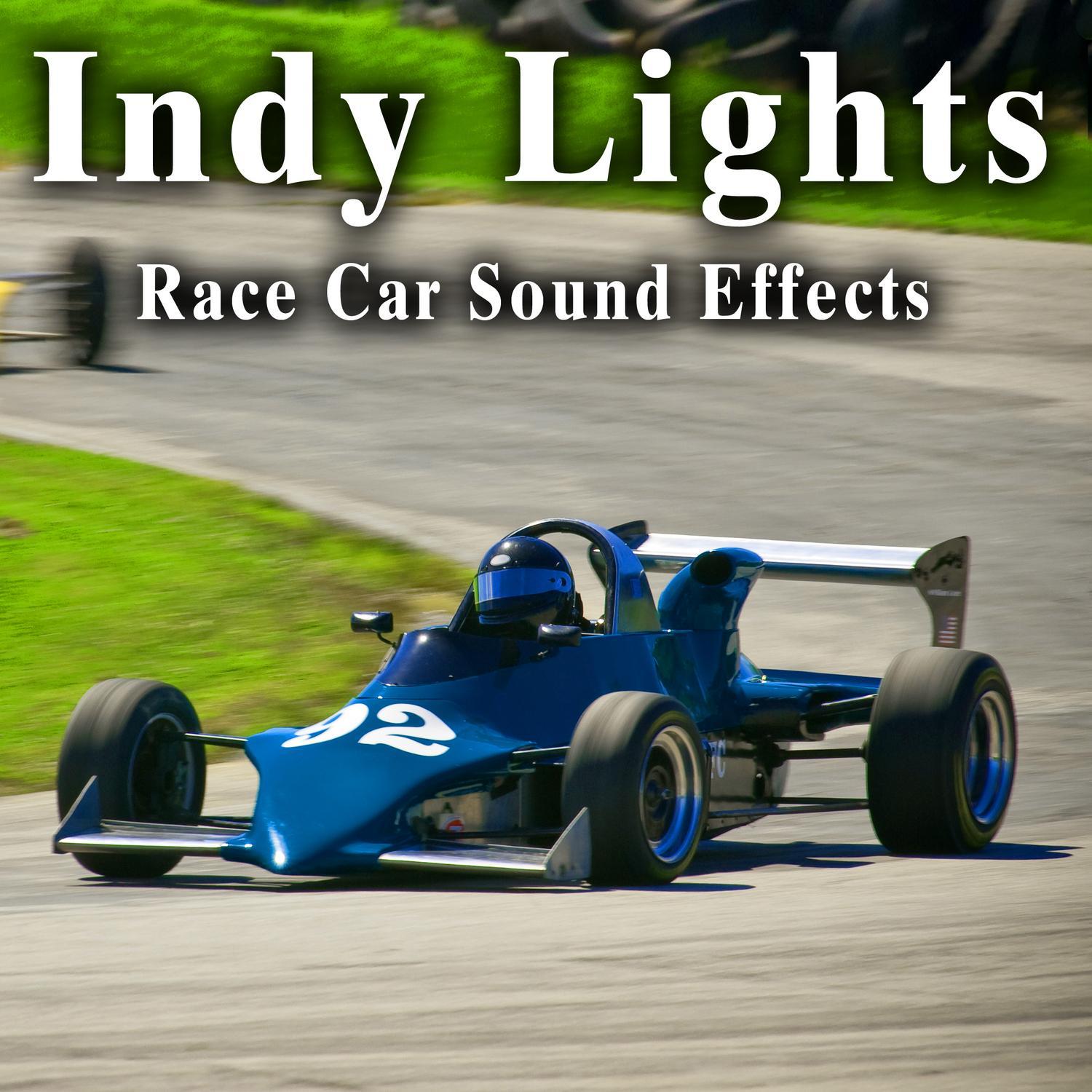 Eleven Indy Lights Cars Pass by Fast from Left to Right on a on a Straight Away